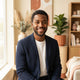 A friendly and diverse male portrait headshot for a customer testimonial badge.